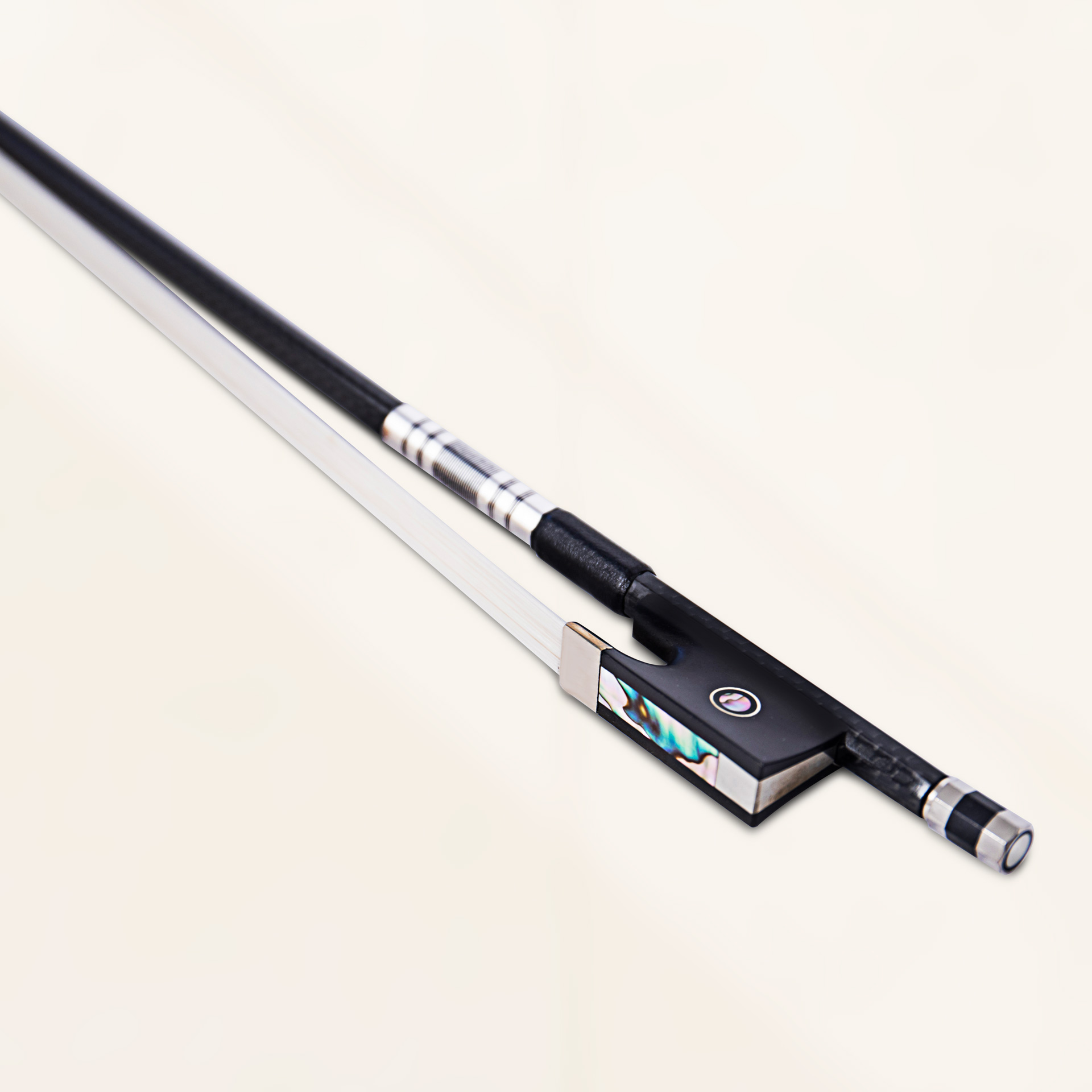 Angled close-up view of violin bow in black grey weave finish showing carbon fiber weave and bronze winding