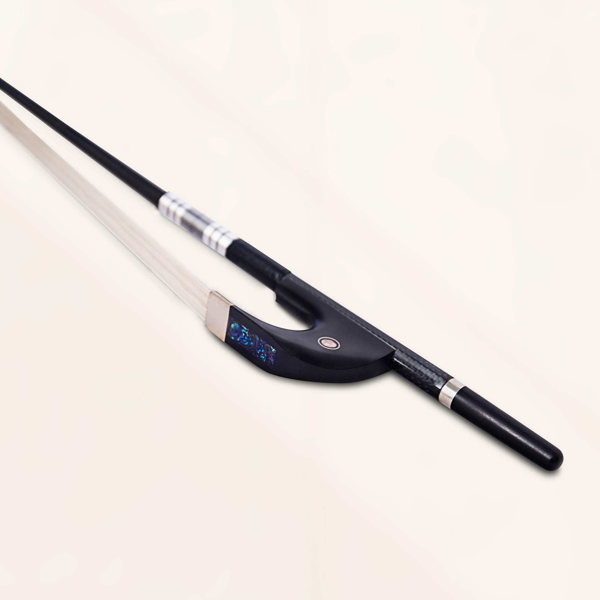 Angled close-up view of bass - german bow in black grey weave finish showing carbon fiber weave and bronze winding