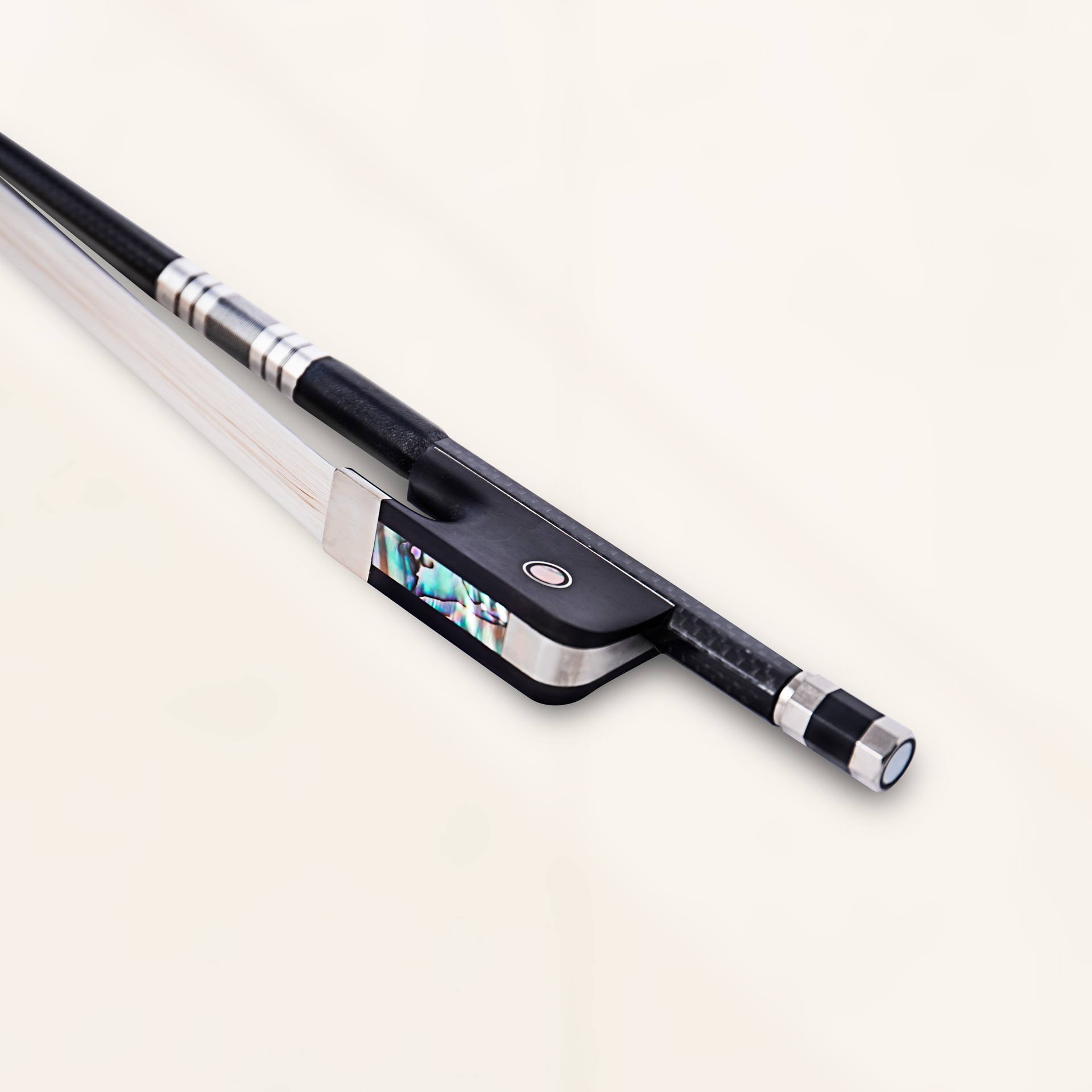 Angled close-up view of bass - french bow in black grey weave finish showing carbon fiber weave and bronze winding