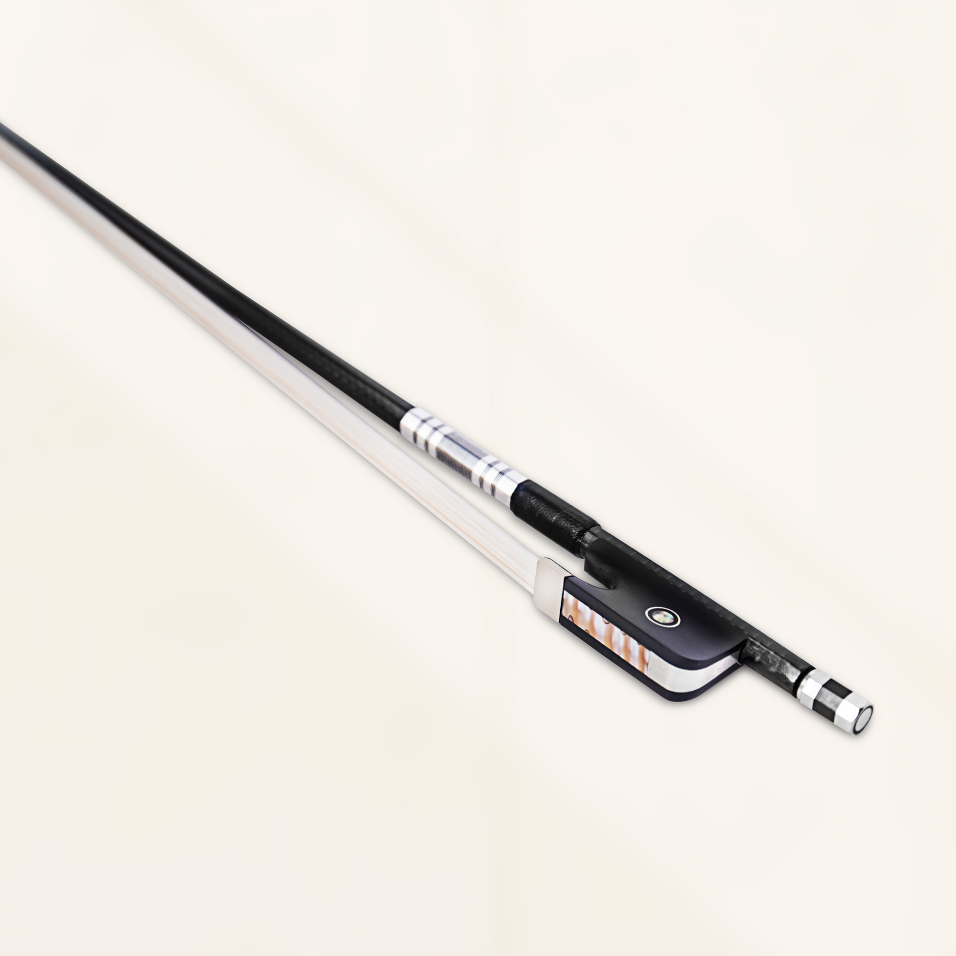 Angled close-up view of viola bow in black grey weave finish showing carbon fiber weave and bronze winding